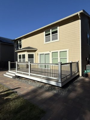 Custom Composite Deck with Aluminum Balusters – Completed September 2025. - Custom composite deck and railing installation completed in September 2025. Finished with composite decking, white fascia trim, and a composite railing system with aluminum balusters and drink rail. Designed for low maintenance and long-term durability.