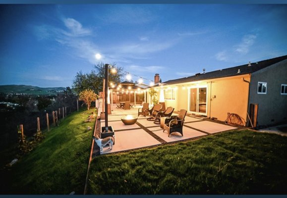 Mountain View Backyard - Our team completed a backyard remodel for new homeowners who wanted to fully enjoy their beautiful backyard view. We incorporated large concrete pavers surrounded by black gravel, creating a modern and sleek look. For entertainment purposes, we have also added a bar where the homeowners can enjoy drinks with friends and family. Additionally, for a pop of green we added a grass area for their pets to enjoy, making the space both functional and appealing. Mountain View Backyard - Our team completed a backyard remodel for new homeowners who wanted to fully enjoy their beautiful backyard view. We incorporated large concrete pavers surrounded by black gravel, creating a modern and sleek look. For entertainment purposes, we have also added a bar where the homeowners can enjoy drinks with friends and family. Additionally, for a pop of green we added a grass area for their pets to enjoy, making the space both functional and appealing.