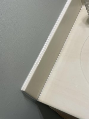 caull - remove old caulk and apply new smooth caulk joint