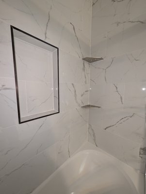 Bathtub Remodel Jan 2025 - This remodel was done on a partially updated bathroom. the owner had a relatively new vanity and toilet installed, which made the floor, shower, and fixtures stick out like a sore thumb. After the shower, floor, light fixture, and baseboards were updated the customers were so excited. The owner stated multiple time, "I can't believe I own something so nice." Bathtub Remodel Jan 2025 - This remodel was done on a partially updated bathroom. the owner had a relatively new vanity and toilet installed, which made the floor, shower, and fixtures stick out like a sore thumb. After the shower, floor, light fixture, and baseboards were updated the customers were so excited. The owner stated multiple time, "I can't believe I own something so nice."