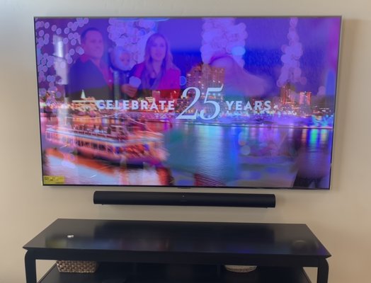 Extreme Slim Wall Mount - This is the 83-inch LG OLED Gallery Edition TV. This TV hugs the wall with no visible mounting system. All wires are hidden in the wall for a clean custom job. To accompany such a beautiful TV the customer bought the SONOS ARC with Subwoofer to create not only a visually pleasing experience but one that sounds amazing too.