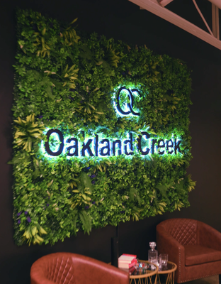 Backlit Plant Wall Sign - Biophilic Interior Installation - Bringing nature indoors! We created this stunning biophilic design that perfectly combines brand identity with a living, breathing environment. This unique installation features custom white LED neon lettering seamlessly integrated into lush artificial plant walls, creating an organic and welcoming atmosphere for this real estate office space.
Project Highlights:
- Innovative biophilic design - Custom LED integrated with artificial greenery for a living wall effect
- Professional interior branding - Clean white LED creates sophisticated contrast against natural textures
- Modular construction - Multiple plant wall panels allow for flexible arrangement and future reconfiguration
- Ambient lighting - Soft LED illumination enhances the space without overwhelming the natural aesthetic
- Low maintenance solution - Artificial plants provide the beauty of nature without ongoing care requirements
- Custom fabrication - Hand-built frames and precise LED placement for seamless integration
This project showcases our ability to think beyond traditional signage, creating immersive brand experiences that transform interior spaces. From concept through installation, we collaborated closely with our client to deliver a signature design element that reflects their connection to natural spaces and community growth.
Services Provided: Custom LED Backlit Sign design, artificial plant wall fabrication, interior installation, ambient lighting design
Ready to create something extraordinary for your space? Let Meon Neon bring your vision to life! Backlit Plant Wall Sign - Biophilic Interior Installation - Bringing nature indoors! We created this stunning biophilic design that perfectly combines brand identity with a living, breathing environment. This unique installation features custom white LED neon lettering seamlessly integrated into lush artificial plant walls, creating an organic and welcoming atmosphere for this real estate office space.
Project Highlights:
- Innovative biophilic design - Custom LED integrated with artificial greenery for a living wall effect
- Professional interior branding - Clean white LED creates sophisticated contrast against natural textures
- Modular construction - Multiple plant wall panels allow for flexible arrangement and future reconfiguration
- Ambient lighting - Soft LED illumination enhances the space without overwhelming the natural aesthetic
- Low maintenance solution - Artificial plants provide the beauty of nature without ongoing care requirements
- Custom fabrication - Hand-built frames and precise LED placement for seamless integration
This project showcases our ability to think beyond traditional signage, creating immersive brand experiences that transform interior spaces. From concept through installation, we collaborated closely with our client to deliver a signature design element that reflects their connection to natural spaces and community growth.
Services Provided: Custom LED Backlit Sign design, artificial plant wall fabrication, interior installation, ambient lighting design
Ready to create something extraordinary for your space? Let Meon Neon bring your vision to life!
