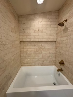 Bathroom Remodel - Our client wished to upgrade their master tub shower with a larger tub and a beautiful Tavertine Tile surround with a large Niche. Our clients are thrilled with their new BathTub. Bathroom Remodel - Our client wished to upgrade their master tub shower with a larger tub and a beautiful Tavertine Tile surround with a large Niche. Our clients are thrilled with their new BathTub.
