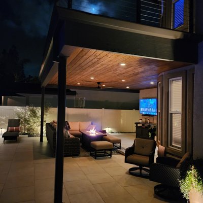 1990's Old school to a Contemporary Modern Classic - This complete Back and Front yard with pool, spa and a patio cover that was falling apart hadn't been touched since 1997 and now it was time to take it from Dull to Dynamic.
Concrete Creations Inc. was awarded the contract to make this happen and we removed practically every little item except for a Family loved Lime Tree.
The patio cover was an old trex with wood rails that was turned into an expanded LED lit, stained wood T&G ceiling outdoor leaving area below , walking deck, and a Powder coated steel rail system and Stainless steel cabling above.
The pool and spa had old cast in place concrete, 90's tile, and old Pebbletech that would tear the skin right off your toes. We added custom made factory sealed white Concrete coping, NPT
blue waterline tile, Aquabella white subway tile for the RBB, and a white quartz spillway. Microbrights replaced the old fiber optic system, Finally NPT Stonescapes Tahoe Blue Puerto Rican Blend pool finish was added.
The decking was old Exposed aggregate concrete and we laid 24"x24" white pavers which were offset to cover the entire surface except for the perimeter planting areas.
The tiny conversation area with a 2 person gas fireplace was turned to a 6 person 4x6 rectangle fire pit with blue fireglass to match the waterline tile.
The landscape area had old leggy plants and an inefficient sprayer type irrigation system that was replaced by a Hunter ultra efficient drip system with plant specific drip emitters. We also installed all waterwise plants with prepared soil, weed barrier, black and Tan beach rock, and Palm Springs gold DG out in the front yard.
This complete yard and pool renovation was entirely completed by our in house craftsmen and Landscaping crew. No stone was left unturned but the outcome was a brand new contemporary styled updated look that will be worth twice what the owners paid for resale of the home one day. 1990's Old school to a Contemporary Modern Classic - This complete Back and Front yard with pool, spa and a patio cover that was falling apart hadn't been touched since 1997 and now it was time to take it from Dull to Dynamic.
Concrete Creations Inc. was awarded the contract to make this happen and we removed practically every little item except for a Family loved Lime Tree.
The patio cover was an old trex with wood rails that was turned into an expanded LED lit, stained wood T&G ceiling outdoor leaving area below , walking deck, and a Powder coated steel rail system and Stainless steel cabling above.
The pool and spa had old cast in place concrete, 90's tile, and old Pebbletech that would tear the skin right off your toes. We added custom made factory sealed white Concrete coping, NPT
blue waterline tile, Aquabella white subway tile for the RBB, and a white quartz spillway. Microbrights replaced the old fiber optic system, Finally NPT Stonescapes Tahoe Blue Puerto Rican Blend pool finish was added.
The decking was old Exposed aggregate concrete and we laid 24"x24" white pavers which were offset to cover the entire surface except for the perimeter planting areas.
The tiny conversation area with a 2 person gas fireplace was turned to a 6 person 4x6 rectangle fire pit with blue fireglass to match the waterline tile.
The landscape area had old leggy plants and an inefficient sprayer type irrigation system that was replaced by a Hunter ultra efficient drip system with plant specific drip emitters. We also installed all waterwise plants with prepared soil, weed barrier, black and Tan beach rock, and Palm Springs gold DG out in the front yard.
This complete yard and pool renovation was entirely completed by our in house craftsmen and Landscaping crew. No stone was left unturned but the outcome was a brand new contemporary styled updated look that will be worth twice what the owners paid for resale of the home one day.