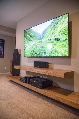 mounting tv canceled the wires hung floating shelves and setup stereo equipment - this customer wanted their entertainment area redone. they were tired of seeing all the wires and wanted a new look. mounting tv canceled the wires hung floating shelves and setup stereo equipment - this customer wanted their entertainment area redone. they were tired of seeing all the wires and wanted a new look.
