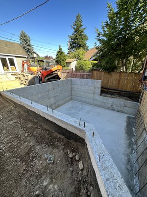 Foundation - For this project, we removed an old foundation, debris and garbage and excavated for the new foundation and all utilities. Foundation - For this project, we removed an old foundation, debris and garbage and excavated for the new foundation and all utilities.