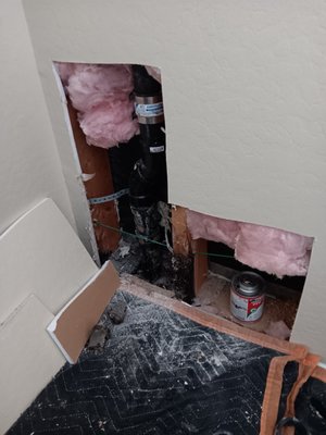 Leak seeping onto living room carpet. - customer called about section of carpet floor being wet in living room. she's had issues for months on and off. from this I deduced it was a drain leak and not a constant water line leak. I noticed leak was in a corner section by wall asked if they had upstairs bathroom above us which they did. So next option was to open up drywall which did not have water stains but I figured drain line passing through that corner section. As u can see the drain was there all I had to do was figure out was which fixture it was connected to. Once the big tub was running water I Immediately noticed the leak and sever Crack the drain pipe had. cut out section and rebuilt drain line. drywall repair I don't do I'm only a licensed plumber. Leak seeping onto living room carpet. - customer called about section of carpet floor being wet in living room. she's had issues for months on and off. from this I deduced it was a drain leak and not a constant water line leak. I noticed leak was in a corner section by wall asked if they had upstairs bathroom above us which they did. So next option was to open up drywall which did not have water stains but I figured drain line passing through that corner section. As u can see the drain was there all I had to do was figure out was which fixture it was connected to. Once the big tub was running water I Immediately noticed the leak and sever Crack the drain pipe had. cut out section and rebuilt drain line. drywall repair I don't do I'm only a licensed plumber.