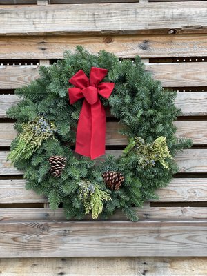 Christmas Wreaths - We use only the fullest, freshest boughs with natural tips from Pacific Northwest native Noble Fir to handcraft our traditional yet elegant Christmas Wreaths. Noble Fir are known for their fragrant, long lasting, silvery blue needles. It is not unusual to see a Noble Fir wreath still adorning a front door with style through the Holidays and into Spring!
