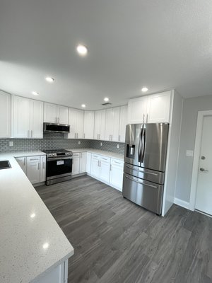 Complete gut rehab kitchen. - Completely got rehabbed kitchen, with 42” upper cabinets for extra storage and extravagant look, finished with white quartz counter and glass backsplash. All new appliances, flooring and plumbing. Upgraded recessed lighting for this room to shine. Complete gut rehab kitchen. - Completely got rehabbed kitchen, with 42” upper cabinets for extra storage and extravagant look, finished with white quartz counter and glass backsplash. All new appliances, flooring and plumbing. Upgraded recessed lighting for this room to shine.