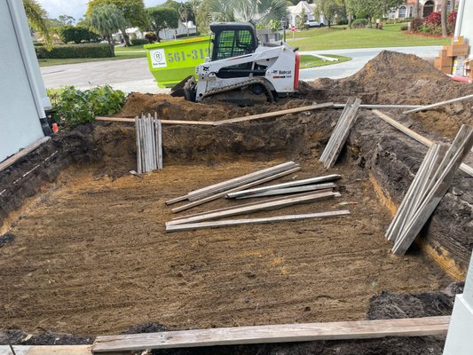 Landscape clearing - This customer wanted their existing landscaping and paver removed then excavated the site for the pool company to form the fountain. we were able to precisely remove only the required pavers while not damaging the rest of the driveway. Our dumpsters were also used onsite for the contractor on the remainder of the project. Call today to get your free estimate! Landscape clearing - This customer wanted their existing landscaping and paver removed then excavated the site for the pool company to form the fountain. we were able to precisely remove only the required pavers while not damaging the rest of the driveway. Our dumpsters were also used onsite for the contractor on the remainder of the project. Call today to get your free estimate!