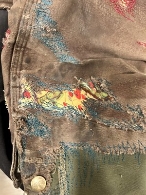 Surface design on vintage garment - My client creates up cycled garments and wanted me to patch and repair as well as give some service design to this damaged area. This is what I came up with, over stitching times in that area. Customer was pleased. Surface design on vintage garment - My client creates up cycled garments and wanted me to patch and repair as well as give some service design to this damaged area. This is what I came up with, over stitching times in that area. Customer was pleased.