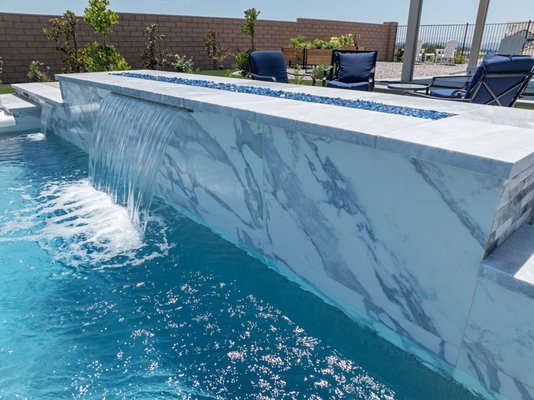 Temecula pool only project - New pool only project in Temecula includes large format porcelain facing. Seldom used on pools but adds a distinct look to the project since no water line traditional tile was used. The project was landscaped mostly by the owner, it includes a free standing and attached patio cover. Pre-built fire table and barbeque island. Temecula pool only project - New pool only project in Temecula includes large format porcelain facing. Seldom used on pools but adds a distinct look to the project since no water line traditional tile was used. The project was landscaped mostly by the owner, it includes a free standing and attached patio cover. Pre-built fire table and barbeque island.