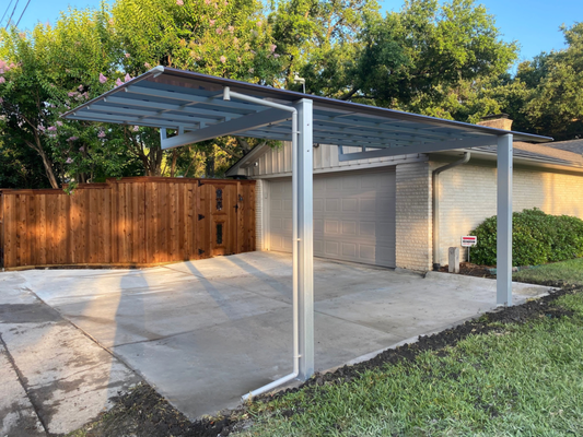 Driveway Replacement + Carport Install (Dallas, TX) - This home had a cracked old driveway which we replaced. We also installed an aluminum carport. Embedded posts within concrete, seamless in one pour.