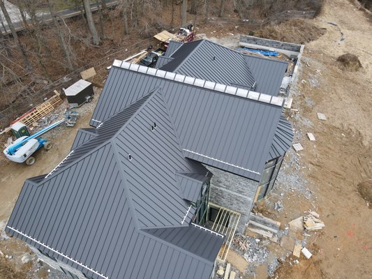 Standing Seam Metal Roofing - These pictures include new construction in Villanova PA and an historical Circa 1800 farmhouse. The new construction chose a matte black finish to match the gray stone facade. The farmhouse used a charcoal gray finish. The charcoal gray color appearance changes slightly from dark gray to slate gray depending on the sun exposure, Standing Seam Metal Roofing - These pictures include new construction in Villanova PA and an historical Circa 1800 farmhouse. The new construction chose a matte black finish to match the gray stone facade. The farmhouse used a charcoal gray finish. The charcoal gray color appearance changes slightly from dark gray to slate gray depending on the sun exposure,