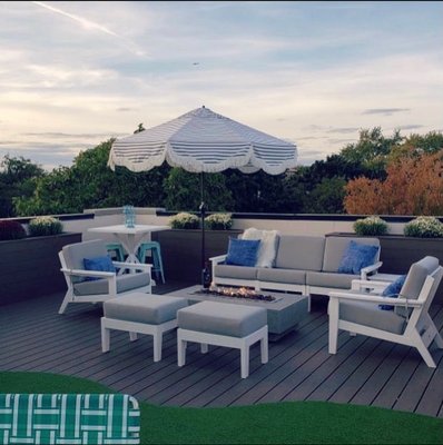 Barry project - A Deckorators Composite Roof Deck with fire pit and planters.