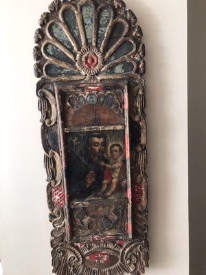 On Site Appraisal Assignment - This iconic carved and polychrome work of "Adoration of the Christ Child," bears all the hallmarks of antiquity; the colour palette used in the rendering itself, elements of design, worn, carving and chipping & faded polychrome surround. In point of fact, it was a faithful reproduction or, at worst, an intentional deception.  If you are at a loss as to what, "gives it away, " ring me up and I will be glad to explain the rudiments of identifying works on canvas, wood panel, tin & copper; so this costly mistake may never happen to you.  No charge or obligation, for your self-edification. (my pastime.)