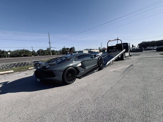 Lamborghini SVJ Transport from West Palm to Ruskin Fl. - Exotic transport is our specialty. Check out this Lamborghini Aventador SVJ getting the VIP treatment!
In need of a tow? We got you covered! From flat tires and dead batteries to complex recoveries, we handle it all with expertise and efficiency. Experience the difference of working with the best in the business. Call for a quote today!
941.777.0766 Lamborghini SVJ Transport from West Palm to Ruskin Fl. - Exotic transport is our specialty. Check out this Lamborghini Aventador SVJ getting the VIP treatment!
In need of a tow? We got you covered! From flat tires and dead batteries to complex recoveries, we handle it all with expertise and efficiency. Experience the difference of working with the best in the business. Call for a quote today!
941.777.0766