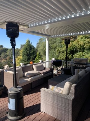 Struxure at Baker residence, Aptos - This was a 2 zone StruXure patio cover. It has a beam chase down the middle with LED lights. It is attached to the roof on one end and has posts on the other.