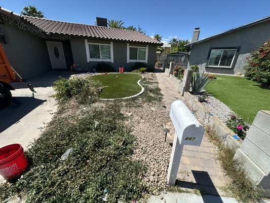 Yard clean up / landscape removal - This front yard had heavy weed growth and overgrown ground cover that made the space look messy and neglected. We removed the unwanted vegetation, cleaned up the landscape rock, and hauled away all debris to give the property a much cleaner, more maintained appearance. The result is a simple but noticeable curb appeal improvement that makes the whole front of the home look more presentable.