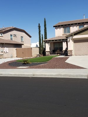 front yard remodeling - We've took a normal yard full of weeds and transformed it into our customers dream of having a low maintenance yard with, different color rocks, artificial turfgrass, and red mulch. a lil bit of Asian spice added to it. front yard remodeling - We've took a normal yard full of weeds and transformed it into our customers dream of having a low maintenance yard with, different color rocks, artificial turfgrass, and red mulch. a lil bit of Asian spice added to it.