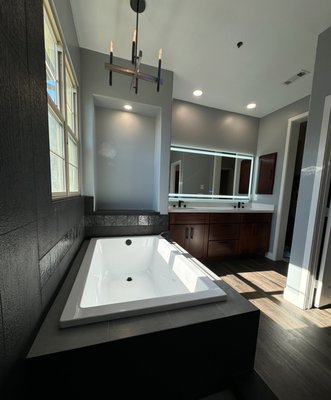 Elegant Unique Bathroom - In this  project we combined our client's ideas, and the result was an elegant bathroom with multiple unique details such as dark tiles, quartz leather, espresso cabinets, LED illuminated mirror, with recessed GFCI cabinets inside, drop in deck tub, smart toilet bidet and water proof VLP flooring.