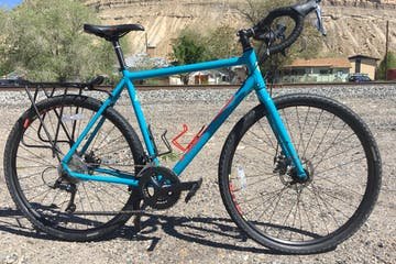 Gravel Bikes - Hitting the Back Roads?
Want to ride the back roads of Palisade to visit the wineries or explore the region’s beautiful back-country routes? Our gravel bikes are the perfect choice for extended day rides and multi-day hut trips. The Kona Rove DL has powerful disc brakes, fenders for when you’re caught in that occasional rain storm, and 2×9-speed gearing for the comfort and range needed to access any kind of road in any kind of weather. They come with a rear rack, and panniers are available as an add-on for extended trips. Gravel Bikes - Hitting the Back Roads?
Want to ride the back roads of Palisade to visit the wineries or explore the region’s beautiful back-country routes? Our gravel bikes are the perfect choice for extended day rides and multi-day hut trips. The Kona Rove DL has powerful disc brakes, fenders for when you’re caught in that occasional rain storm, and 2×9-speed gearing for the comfort and range needed to access any kind of road in any kind of weather. They come with a rear rack, and panniers are available as an add-on for extended trips.