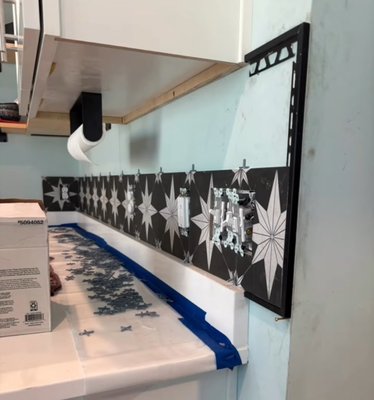 Kitchen Backsplash Install - This house had just been a recent build, and the new owners wanted to add some unique style to their kitchen space. I installed this beautiful backsplash of their choice in their kitchen creating an eye popping stylish space in their new home.
