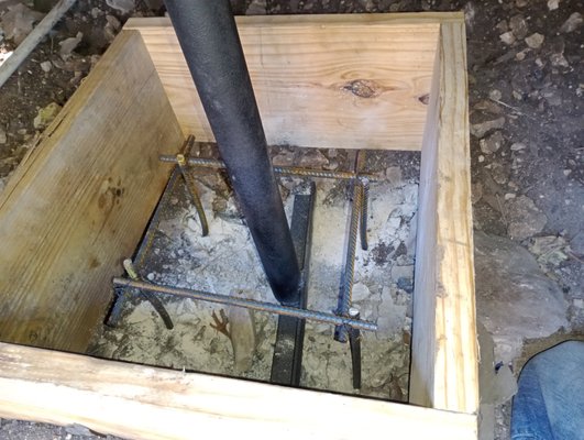 Mobile Home Retrofit - Our team completed a mobile home retrofit designed to strengthen the foundation and extend the home’s structural life. The process began with forming and reinforcing a footing using rebar and steel anchor pipes. Concrete was then poured to create a permanent base, locking the anchor securely in place. Once cured, the home’s steel frame was welded directly to the anchor brackets, ensuring a continuous transfer of weight to the new footing. To finish, all welded sections were sealed and coated, protecting against rust and future wear.
This retrofit provides long-lasting stability, improved safety, and peace of mind for the homeowner, ensuring the home is ready to stand strong for years to come. Mobile Home Retrofit - Our team completed a mobile home retrofit designed to strengthen the foundation and extend the home’s structural life. The process began with forming and reinforcing a footing using rebar and steel anchor pipes. Concrete was then poured to create a permanent base, locking the anchor securely in place. Once cured, the home’s steel frame was welded directly to the anchor brackets, ensuring a continuous transfer of weight to the new footing. To finish, all welded sections were sealed and coated, protecting against rust and future wear.
This retrofit provides long-lasting stability, improved safety, and peace of mind for the homeowner, ensuring the home is ready to stand strong for years to come.