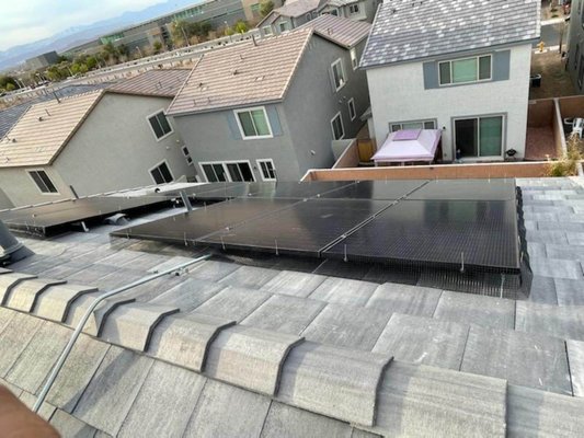 Grid tied solar installation - This home was paying $115 a month renting their electricity.  Now they own their power for $73 a month.
