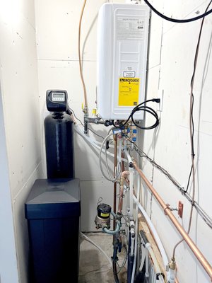 Tankless Water Heater and Water Softener Combo Install - Installing a tankless water heater and water softener combo involves upgrading your home's hot water system with two efficient and complementary appliances. The tankless water heater heats water on demand, while the water softener removes hard minerals from the water supply. Overall, this combo can provide significant energy savings and increased efficiency, as well as improved water quality and less maintenance.
This upgrade is a great investment in the long-term health and comfort of your home. Give us a call today to discuss how we can improve your hot water system! Tankless Water Heater and Water Softener Combo Install - Installing a tankless water heater and water softener combo involves upgrading your home's hot water system with two efficient and complementary appliances. The tankless water heater heats water on demand, while the water softener removes hard minerals from the water supply. Overall, this combo can provide significant energy savings and increased efficiency, as well as improved water quality and less maintenance.
This upgrade is a great investment in the long-term health and comfort of your home. Give us a call today to discuss how we can improve your hot water system!