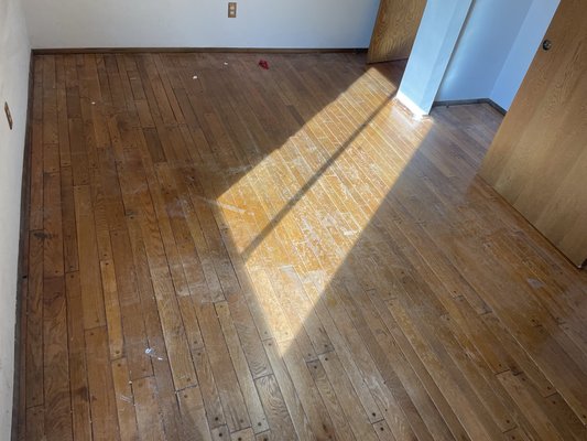 Sand and Finish - This is a one of the bedrooms in this ranch house I’m working on that has some existing peg and grooved red/white oak mix flooring. I have sanded and stained all the wood flooring with Bona Early American color and going to finish it with 2 coats of Bona mega one with a satin sheen