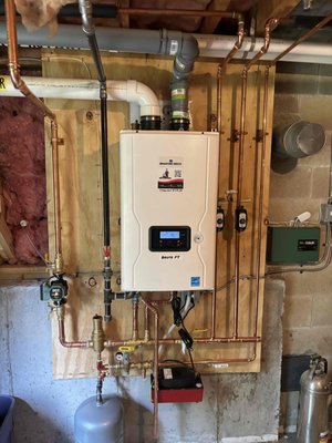Bradford White | Tankless Water Heater - Bradford White Tankless Water Heater Installation in Foxborough, MA

We recently installed a Bradford White tankless water heater for a homeowner in Foxborough, MA. Our team professionally routed the venting to keep the exhaust away from the stairs, installed a new condensate drain beneath the deck, and added a 3/4-inch pressure reducing valve (PRV) set to 65 PSI for optimal water pressure.