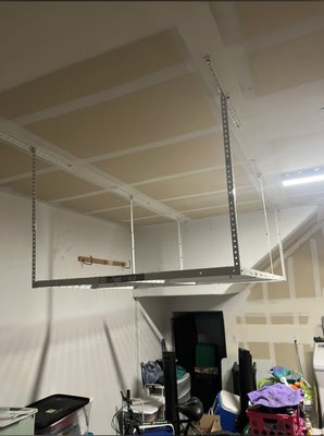 Ceiling-mounted storage rack for garage - These were 8x4 and they need to fit perfectly in this garage while dodging lights, the garage door, and a few other unassuming obstacles. Once I established the positioning of them and how they will mount to the rafters, I was able to mount and assemble using lag bolts. This product is great space saver for any garage. Ceiling-mounted storage rack for garage - These were 8x4 and they need to fit perfectly in this garage while dodging lights, the garage door, and a few other unassuming obstacles. Once I established the positioning of them and how they will mount to the rafters, I was able to mount and assemble using lag bolts. This product is great space saver for any garage.