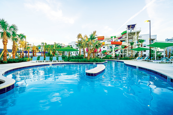Aqua Bay Water Park at Villatel Orlando Resort - Project Overview
Our team at Cody Pools is proud to have delivered an exciting new aquatic experience
at Aqua Bay Water Park at Villatel Orlando Resort, a premier destination that
redefines resort-style recreation. Formerly known as Storey Drive Amenity Park, the
revitalized venue blends thrilling water features with family-friendly design to create a
truly immersive experience for guests.
Key Features
• Amenity Pool: A spacious 5,000 SF resort-style pool with built-in lounging areas and
cabanas.
• Lazy River: A 6,900 SF winding lazy river offering a relaxing ride through lush
landscaping.
• Waterpark Slides: Four high-energy slides that provide exhilarating fun for children,
teens, and adults.
• Interactive Splash Pad: A vibrant activity zone designed for younger guests, with water
cannons, sprays, and climbing features.
Project Highlights
• Design-Build Excellence: Delivered through close collaboration with designers,
engineers, and resort stakeholders.
• Guest Experience First: Every element was tailored to maximize guest comfort, safety,
and excitement.
• Precision Execution: On-time delivery with high attention to quality and durability,
ensuring long-term enjoyment and low maintenance.
Impact
Aqua Bay is now a flagship amenity of the Villatel Orlando Resort experience, driving
increased bookings and elevating the community's reputation as a luxury vacation
destination. The park stands as a testament to Cody Pools' ability to bring bold aquatic
visions to life. Aqua Bay Water Park at Villatel Orlando Resort - Project Overview
Our team at Cody Pools is proud to have delivered an exciting new aquatic experience
at Aqua Bay Water Park at Villatel Orlando Resort, a premier destination that
redefines resort-style recreation. Formerly known as Storey Drive Amenity Park, the
revitalized venue blends thrilling water features with family-friendly design to create a
truly immersive experience for guests.
Key Features
• Amenity Pool: A spacious 5,000 SF resort-style pool with built-in lounging areas and
cabanas.
• Lazy River: A 6,900 SF winding lazy river offering a relaxing ride through lush
landscaping.
• Waterpark Slides: Four high-energy slides that provide exhilarating fun for children,
teens, and adults.
• Interactive Splash Pad: A vibrant activity zone designed for younger guests, with water
cannons, sprays, and climbing features.
Project Highlights
• Design-Build Excellence: Delivered through close collaboration with designers,
engineers, and resort stakeholders.
• Guest Experience First: Every element was tailored to maximize guest comfort, safety,
and excitement.
• Precision Execution: On-time delivery with high attention to quality and durability,
ensuring long-term enjoyment and low maintenance.
Impact
Aqua Bay is now a flagship amenity of the Villatel Orlando Resort experience, driving
increased bookings and elevating the community's reputation as a luxury vacation
destination. The park stands as a testament to Cody Pools' ability to bring bold aquatic
visions to life.