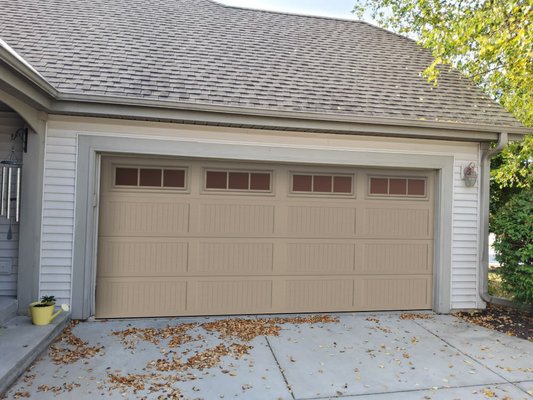 Sussex Door Replacement - This was a garage door replacement, in Sussex, WI, where the customer's cable broke, but they decided to upgrade their door instead of repairing it.  The customers gave us an idea of expectations and we made a couple of mock-ups, using the "before" picture to help them decide on which door the wanted to commit to. The last photo in the line up, is the final result.