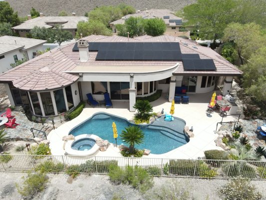 Summerlin Pool Home - This solar installation project by Sun Source Energy features a carefully designed and efficient solar panel system integrated into two luxury homes in a sunny Las Vegas neighborhood. The panels are strategically placed across the roof to maximize sunlight exposure and ensure optimal energy generation while maintaining the aesthetic appeal of each home. The installations were customized to seamlessly blend with the unique architecture of both properties, one featuring a backyard pool oasis and the other showcasing a sleek, modern design. These systems provide the homeowners with significant energy savings and reduced utility bills, while also contributing to their commitment to sustainability and eco-friendly living. With high-performance American-made solar panels and advanced inverter technology, these projects reflect Sun Source Energy’s expertise in delivering quality solar solutions that enhance both the energy efficiency and value of residential properties. Summerlin Pool Home - This solar installation project by Sun Source Energy features a carefully designed and efficient solar panel system integrated into two luxury homes in a sunny Las Vegas neighborhood. The panels are strategically placed across the roof to maximize sunlight exposure and ensure optimal energy generation while maintaining the aesthetic appeal of each home. The installations were customized to seamlessly blend with the unique architecture of both properties, one featuring a backyard pool oasis and the other showcasing a sleek, modern design. These systems provide the homeowners with significant energy savings and reduced utility bills, while also contributing to their commitment to sustainability and eco-friendly living. With high-performance American-made solar panels and advanced inverter technology, these projects reflect Sun Source Energy’s expertise in delivering quality solar solutions that enhance both the energy efficiency and value of residential properties.