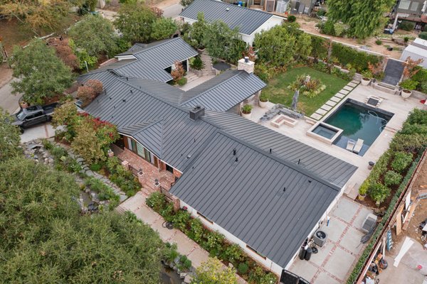 Snap Lock System Standing Seam Metal Roof / Granada Hills Project - This project was done in Fall 2023, A complete remodel located in Granada Hills, with a total of 7,500 square feet of roof. We installed 16", 24-gauge flat panels with 1 1/2" seam height, narrow rib clip system, in Matte Black color. We installed new 1/2" CDW plywood as well as custom chimney metal flashing, along with Snap-Z ridge vent for attic ventilation. We finished the project by installing new 5" custom fascia gutters. This project took 4 weeks from start to finish. You can watch the full start to finish video from this link: https://vimeo.com/manage/videos/881817462 Snap Lock System Standing Seam Metal Roof / Granada Hills Project - This project was done in Fall 2023, A complete remodel located in Granada Hills, with a total of 7,500 square feet of roof. We installed 16", 24-gauge flat panels with 1 1/2" seam height, narrow rib clip system, in Matte Black color. We installed new 1/2" CDW plywood as well as custom chimney metal flashing, along with Snap-Z ridge vent for attic ventilation. We finished the project by installing new 5" custom fascia gutters. This project took 4 weeks from start to finish. You can watch the full start to finish video from this link: https://vimeo.com/manage/videos/881817462