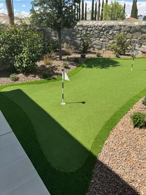 Golf Turf and Personal Putting Green - Imagine stepping out your back door onto your very own putting green—a perfect setting for both practice and enjoyment. With your own custom putting green, you can do more than just refine your skills. Picture hosting, chipping and putting contests, creating fun games for family and friends, and providing an ideal way to introduce children to the game of golf.
At El Paso Artificial Grass Supply, we specialize in designing and installing high-quality putting greens that bring the experience of a professional course right to your home. Whether you're looking to enhance your game or simply enjoy golf in a new way, our team can help you create the perfect space. Contact us today to learn how we can transform your backyard into a golfer's paradise!
