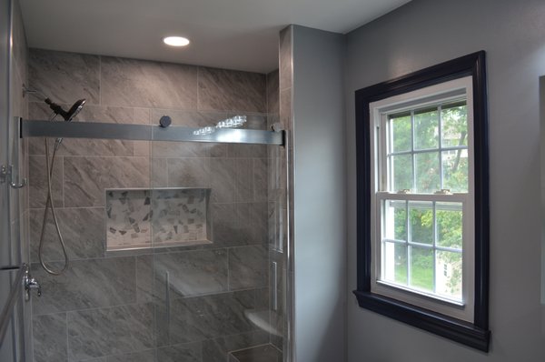 Modern Bathroom and Layout Renovation - This bathroom had a unique layout. Once you entered, the vanity was in front, the toilet and the shower was nestled in a separate room to the left, and a step-in closet to the right. We re-worked the layout to create a bigger, more cohesive bathroom. We framed and closed the closet to open into the hallway. Finished with sleek and modern finishes. This bathroom was a beautiful upgrade for an amazing family. Modern Bathroom and Layout Renovation - This bathroom had a unique layout. Once you entered, the vanity was in front, the toilet and the shower was nestled in a separate room to the left, and a step-in closet to the right. We re-worked the layout to create a bigger, more cohesive bathroom. We framed and closed the closet to open into the hallway. Finished with sleek and modern finishes. This bathroom was a beautiful upgrade for an amazing family.