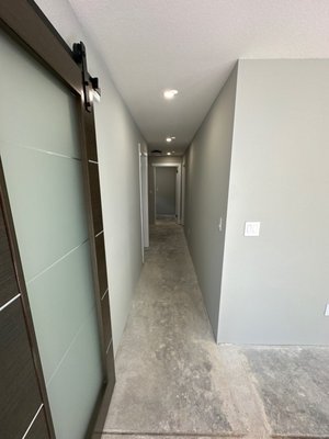 Drywall Replacement and French Drain installation - After a heavy storm caused water intrusion in a client's home, we stepped in to help restore and protect the property. Once the damaged drywall was removed, Lombera Construction replaced all affected areas, carefully matching the existing texture and repainting the entire downstairs unit for a seamless finish.
To address the root of the problem, we installed a comprehensive French drain system around the home. This included a 4-inch solid pipe connected to the downspouts and a 4-inch perforated pipe laid in a trench filled with drain rock. The system was designed to guide water—using gravity—toward a 6x6 catch basin. There, we installed a sump pump that automatically activates when water reaches a certain level, preventing future flooding. The entire trench was wrapped in filter fabric to keep soil and drain rock separate, ensuring long-term drainage efficiency. Drywall Replacement and French Drain installation - After a heavy storm caused water intrusion in a client's home, we stepped in to help restore and protect the property. Once the damaged drywall was removed, Lombera Construction replaced all affected areas, carefully matching the existing texture and repainting the entire downstairs unit for a seamless finish.
To address the root of the problem, we installed a comprehensive French drain system around the home. This included a 4-inch solid pipe connected to the downspouts and a 4-inch perforated pipe laid in a trench filled with drain rock. The system was designed to guide water—using gravity—toward a 6x6 catch basin. There, we installed a sump pump that automatically activates when water reaches a certain level, preventing future flooding. The entire trench was wrapped in filter fabric to keep soil and drain rock separate, ensuring long-term drainage efficiency.