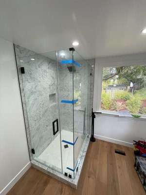Frameless Glass Shower Enclosure - Los Angeles Frameless Shower Enclosure Installation.  Black Hardware.