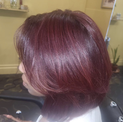 Silk Press on Natural Hair - A silk press is a non-chemical hair straightening technique that uses a flat iron and other tools to give hair a smooth and silky finish.