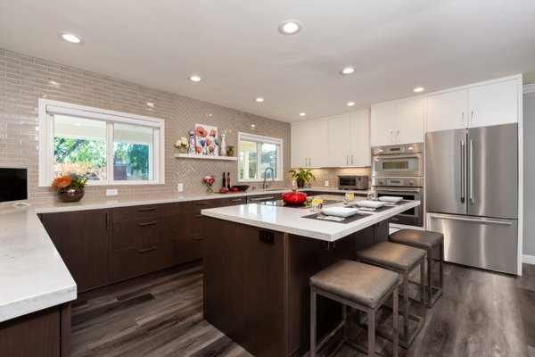 Sunnyvale Kitchen Design & Remodel - This remodel in Sunnyvale created a more open feeling and utilized the island to give additional seating.  The long countertop gives ample space for food prep which the client loves.  Kitchen Design Services provided the design, cabinetry and helped with material selection.