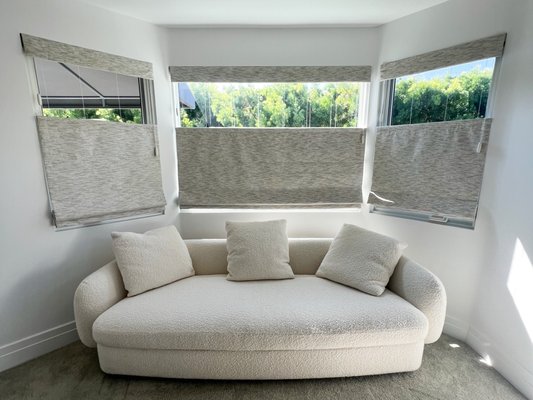 Blackout top roman shades and ripple fold drapery - This client had a very specific set of needs, needing both blackout shades and drapery, but wanted it done with a somewhat tricky sheer fabric, and with very intricate mounting considerations. We were able to make fully custom product that perfectly fit their space, opting for a dual drape on their primary bedroom slider with a sheer face fabric with an operable blackout lining behind it. Needing a more tailored look for their roman shades, we were able to fuse them to the lining, achieving the exact function they were looking for. Blackout top roman shades and ripple fold drapery - This client had a very specific set of needs, needing both blackout shades and drapery, but wanted it done with a somewhat tricky sheer fabric, and with very intricate mounting considerations. We were able to make fully custom product that perfectly fit their space, opting for a dual drape on their primary bedroom slider with a sheer face fabric with an operable blackout lining behind it. Needing a more tailored look for their roman shades, we were able to fuse them to the lining, achieving the exact function they were looking for.