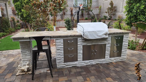 Outdoor Kitchen, Concrete, Pavers, PVC Drip Irrigation, Low Voltage Lighting, High Pressure Mist, Gravel, Plants and Trees, and Turf - This remodel was a complete backyard renovation. We had removal and haul away of old grass, hundreds of boulders, and old irrigation. We brought in new topsoil, added concrete for a basketball court and spa, ran new schedule 40 pvc drip irrigation for the new trees and plants, built an outdoor kitchen, added pavers and turf, low voltage lighting, and high pressure mist and fog. This was a premium project from beginning to end and showcases the creativity and professionalism of our work. Outdoor Kitchen, Concrete, Pavers, PVC Drip Irrigation, Low Voltage Lighting, High Pressure Mist, Gravel, Plants and Trees, and Turf - This remodel was a complete backyard renovation. We had removal and haul away of old grass, hundreds of boulders, and old irrigation. We brought in new topsoil, added concrete for a basketball court and spa, ran new schedule 40 pvc drip irrigation for the new trees and plants, built an outdoor kitchen, added pavers and turf, low voltage lighting, and high pressure mist and fog. This was a premium project from beginning to end and showcases the creativity and professionalism of our work.