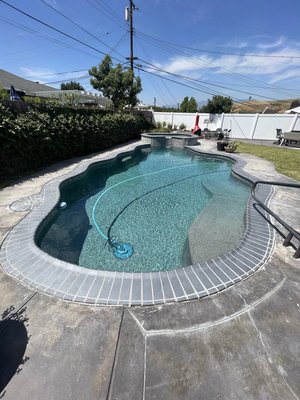 Coping - Tile Remodel - This pool had pebble that was still in very good shape but the owners were not happy with the flagstone coping anymore and the flagstone spillway on the spa wasn’t consistent anymore due to the corrosion. So we had the opportunity to remodel the coping and tile for them!