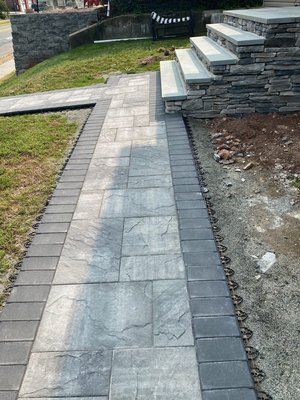 Stone steps and Cambridge pavers walkway - This remodel was done over a brick steps that were deteriorating due to weather and time. Rebuild of steps with cinderblocks patched with two coats of stucco and install stones on sides and blue stone on top of steps. Cambridge pavers used for the walkway.  Stone steps and Cambridge pavers walkway - This remodel was done over a brick steps that were deteriorating due to weather and time. Rebuild of steps with cinderblocks patched with two coats of stucco and install stones on sides and blue stone on top of steps. Cambridge pavers used for the walkway. 