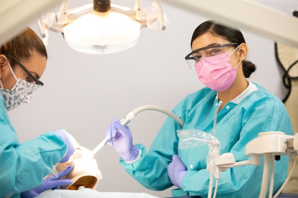 Dental Assistant Program - UEI's Dental Assistant Technician Training Program provides graduates with essential skills for a dental assistant career. It covers disinfecting equipment, assisting in procedures, preventative dentistry, appointment scheduling, and patient record maintenance. The program prepares students for both administrative and clinical roles, including chairside assisting. If you're adept with hands-on work and enjoy interacting with people, consider enrolling. Contact UEI to start your journey in dental assisting.