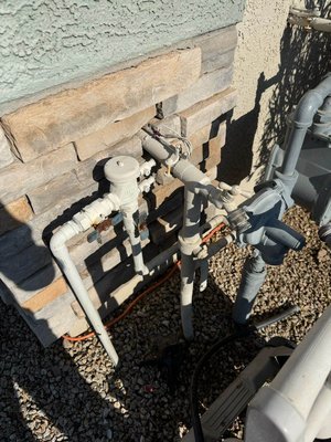 Vacuum Breaker - Water service entry, with shut-off valve and pressure regulator, before and after vacuum breaker installation on hose bib.