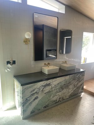 Custom Vanity - The vanity was done for a bathroom remodeling in Austin cover with 3 cm quartz and push to open drawers.